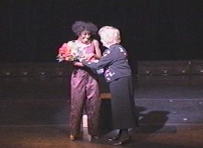 Mrs. Judge, President of NAMI, TN. presents flowers to Wambui after "Balancing Act" at the Ryman Theater on October 22, 2000