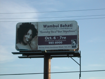 Wambui speaks and performs at a mental health event in Port Huron, MI (2004)