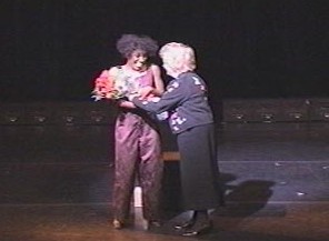 Receiving flowers from Mrs. Judge, Executive Director of NAMI-Tennessee, after the performance of Balancing Act at the Ryman in Nashville.