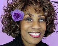 Wambui Bahati with hair flower